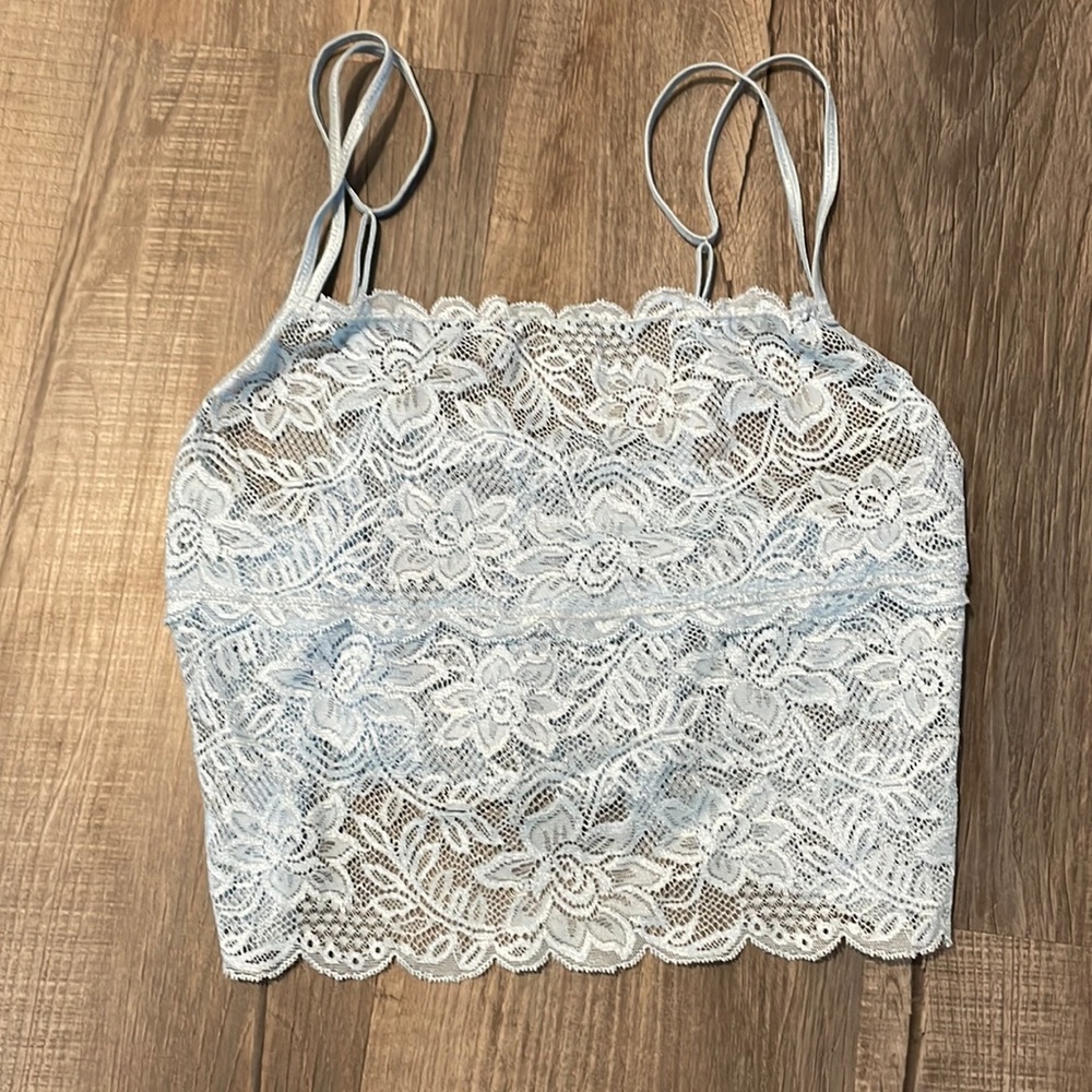 light blue, flowery lace tank top. see through.